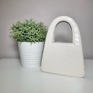 Off-white mini crocodile bag.